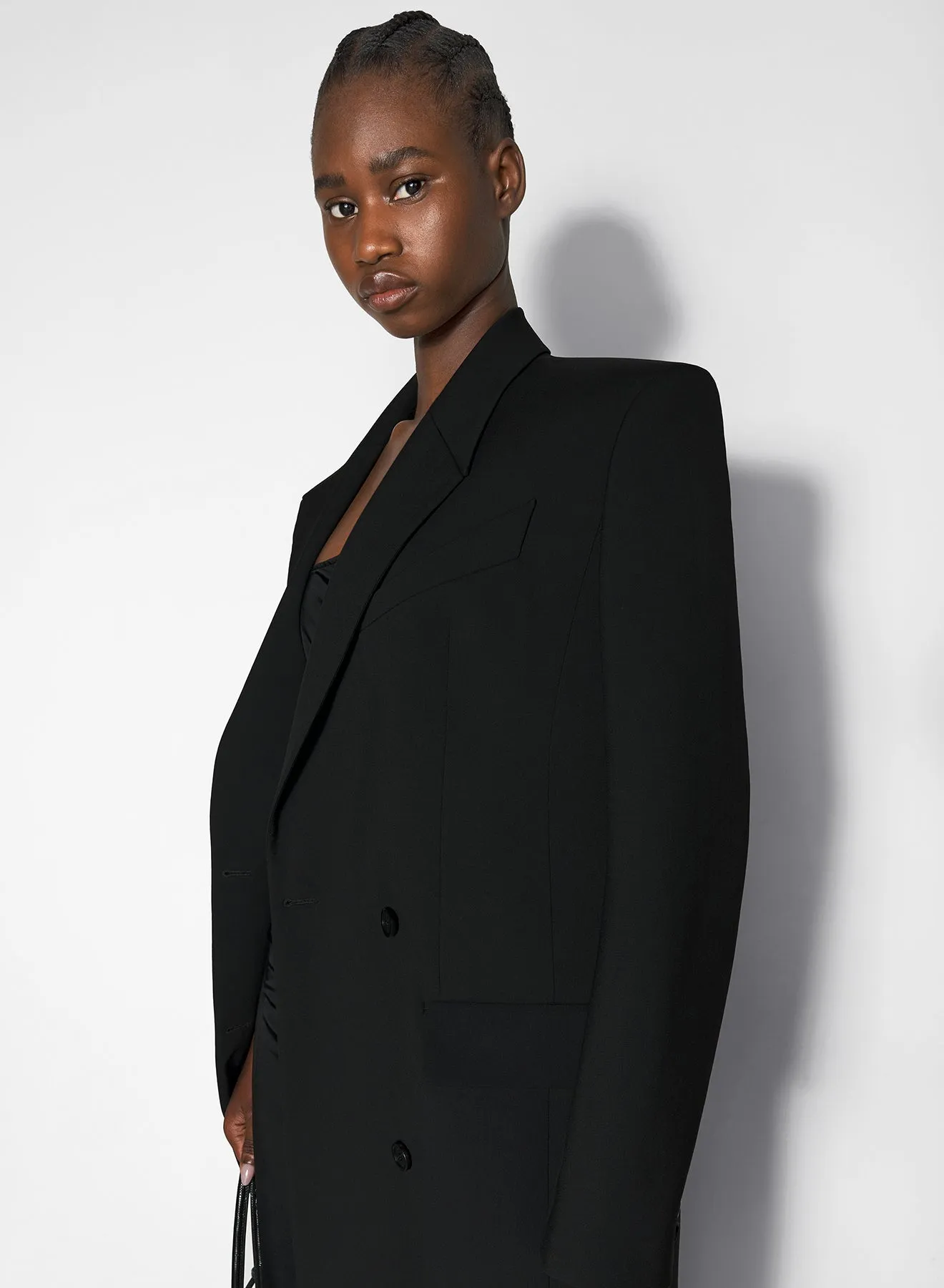 black double-breasted wool coat